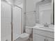 Clean bathroom featuring a walk-in shower, toilet, and vanity with a white countertop at 5414 Catmint Dr, Lake Hamilton, FL 33851