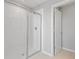 Modern walk-in shower with white tiles and glass door with silver hardware at 5414 Catmint Dr, Lake Hamilton, FL 33851
