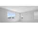 Spacious bedroom with three windows offering plenty of natural light at 5414 Catmint Dr, Lake Hamilton, FL 33851