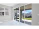 Bright sunroom with tile floors and large sliding glass doors leading to the patio at 5414 Catmint Dr, Lake Hamilton, FL 33851