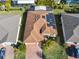 House with solar panels, viewed from above, showing roof and yard at 663 Irvine Ranch Rd, Poinciana, FL 34759