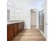 Spacious bathroom with double vanity, walk-in shower, and large closet at 663 Irvine Ranch Rd, Poinciana, FL 34759