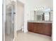 Main bathroom with granite vanity and walk-in shower at 663 Irvine Ranch Rd, Poinciana, FL 34759