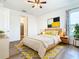 Cozy bedroom with ceiling fan and wood-look flooring at 663 Irvine Ranch Rd, Poinciana, FL 34759