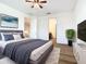 Spacious bedroom with ceiling fan and wood-look flooring at 663 Irvine Ranch Rd, Poinciana, FL 34759