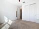 Bedroom with double door closet and neutral decor at 663 Irvine Ranch Rd, Poinciana, FL 34759