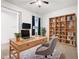 Home office with built-in shelving and desk at 663 Irvine Ranch Rd, Poinciana, FL 34759