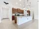 Kitchen with dark brown cabinets, granite countertops, and stainless steel appliances at 663 Irvine Ranch Rd, Poinciana, FL 34759