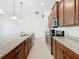 Modern kitchen featuring granite countertops and ample cabinetry at 663 Irvine Ranch Rd, Poinciana, FL 34759