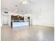 Open concept living area with kitchen, dining area, and tile floors at 663 Irvine Ranch Rd, Poinciana, FL 34759