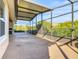 Large screened patio with plenty of space for outdoor enjoyment at 663 Irvine Ranch Rd, Poinciana, FL 34759