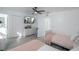Bright bedroom with 2 beds, a TV, two closets and wood look flooring at 733 Calabria Ave, Davenport, FL 33897