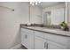 Double vanity bathroom with gray countertops at 890 Pebble Beach Dr, Davenport, FL 33896