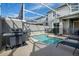 Private pool with grill and lounge chairs at 890 Pebble Beach Dr, Davenport, FL 33896
