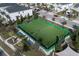Turf field with benches and landscaping surrounded by homes in the community at 890 Pebble Beach Dr, Davenport, FL 33896