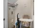 A small utility room space with visible water heater and a few household items at 890 Pebble Beach Dr, Davenport, FL 33896