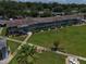 Well-maintained apartment building with large grassy common area, sidewalks, and two-story facade at 1600 W Lake Parker Dr # B23, Lakeland, FL 33805