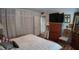 Bedroom featuring closet, TV on dresser, and decor, showcasing space and storage at 1600 W Lake Parker Dr # B23, Lakeland, FL 33805