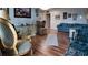 Comfortable living room featuring hardwood floors, artwork, a couch, and eclectic decorations at 1600 W Lake Parker Dr # B23, Lakeland, FL 33805