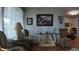 Living room with swan decor table and glass top side table at 1600 W Lake Parker Dr # B23, Lakeland, FL 33805