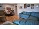 Spacious living room with hardwood floors, a blue sofa, and traditional decor for comfortable living at 1600 W Lake Parker Dr # B23, Lakeland, FL 33805