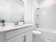 Bathroom featuring a white vanity, toilet, and bathtub with tiled shower at 195 Casavista Dr, Kissimmee, FL 34759