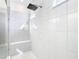 Bright bathroom featuring a tiled shower with mosaic accents and a built-in bench at 195 Casavista Dr, Kissimmee, FL 34759