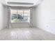 Bright bedroom with a large window framed by stylish curtains and tile flooring, offering a serene retreat at 195 Casavista Dr, Kissimmee, FL 34759