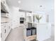 Modern kitchen design featuring white cabinets, island with storage, and stainless appliances at 195 Casavista Dr, Kissimmee, FL 34759