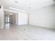 Spacious living room with neutral walls, recessed lighting, and tile flooring, perfect for entertaining at 195 Casavista Dr, Kissimmee, FL 34759