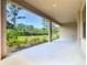 Covered patio featuring an outdoor living space with neutral colors and a view of green landscape at 195 Casavista Dr, Kissimmee, FL 34759
