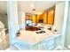 Bright kitchen featuring light countertops, stainless steel appliances, and wooden cabinets at 10786 Savannah Wood Dr # 126, Orlando, FL 32832