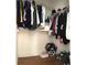 Walk-in closet with hanging racks, shelves, and hardwood floors at 10786 Savannah Wood Dr # 126, Orlando, FL 32832