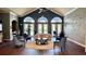 Comfortable lobby with ample seating and French doors leading to the pool at 10786 Savannah Wood Dr # 126, Orlando, FL 32832