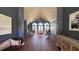 Inviting lobby with high ceilings, elegant seating, and hardwood floors, creating a welcoming atmosphere at 10786 Savannah Wood Dr # 126, Orlando, FL 32832