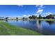 Beautiful pond with a fountain surrounded by lush green grass and well-maintained buildings at 10786 Savannah Wood Dr # 126, Orlando, FL 32832