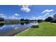 Scenic pond view with lush greenery, offering a serene and picturesque setting for residents at 10786 Savannah Wood Dr # 126, Orlando, FL 32832