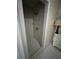 Walk-in shower with marble-like tiled walls at 1750 12Th St, Clermont, FL 34711