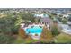 Community pool with clubhouse, playground, and pond at 1940 Banner Ln, St Cloud, FL 34769