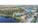 Community pool, clubhouse, playground, and surrounding landscape at 1940 Banner Ln, Saint Cloud, FL 34769