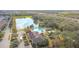 Community pool, clubhouse, and surrounding landscape from above at 1940 Banner Ln, St Cloud, FL 34769