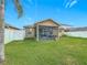 Screened patio overlooking a spacious backyard at 1940 Banner Ln, St Cloud, FL 34769