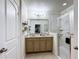 Bathroom with double vanity, granite countertop and a shower at 1940 Banner Ln, St Cloud, FL 34769