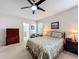 Bright bedroom with ceiling fan and ensuite bathroom access at 1940 Banner Ln, St Cloud, FL 34769