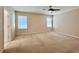 Spacious carpeted bedroom featuring large windows for ample natural light at 1940 Banner Ln, St Cloud, FL 34769