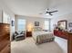 Spacious bedroom with ceiling fan and ensuite bathroom access at 1940 Banner Ln, St Cloud, FL 34769