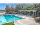 Enjoy the community pool with pergola and lounge chairs at 1940 Banner Ln, St Cloud, FL 34769