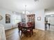 Elegant dining room featuring hardwood floors and a charming wooden hutch at 1940 Banner Ln, St Cloud, FL 34769