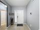 Bright and spacious entryway with tile flooring and access to other rooms at 1940 Banner Ln, St Cloud, FL 34769
