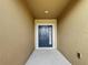 Inviting front door entryway with neutral colored walls at 1940 Banner Ln, St Cloud, FL 34769
